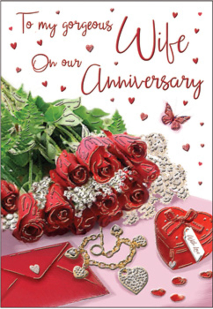 This richly detailed anniversary card depicts a romantic tableau that could easily mirror a real-life arrangement on a dining table in a Hounslow home near Lampton Park. A classic bouquet of red roses occupies centre stage, each bloom perfectly formed with layered, velvety petals that create a deep, captivating spiral of colour. The roses are gathered together with lush green foliage that threads between the blossoms, providing contrast and giving the impression of fullness and natural abundance, just like a hand-tied bouquet freshly delivered on a milestone anniversary. Surrounding the roses, subtle decorative elements reinforce the sense of memory and celebration: a jewellery set laid out carefully, perhaps earrings and a pendant, shimmering faintly; a vivid red box that hints at a treasured gift waiting to be opened; and delicate heart motifs scattered like confetti across the surface. The background appears soft and gently blurred, allowing the texture of each object to stand out-the metallic shine of jewellery, the smooth finish of the box, and the soft sheen of petals and leaves. A scripted message, elegant and flowing, runs across part of the card, its calligraphic lines evoking the sweetness of hand-penned words. The overall atmosphere feels warm, enveloping, and undeniably romantic, capturing the sense of two people taking time to mark their journey together. Crafted with an expert florist's understanding of colour harmony and emotional nuance, this design speaks of thoughtful gestures, shared glances across a table, and the comforting reassurance of love that has been carefully tended year after year in Hounslow and beyond.